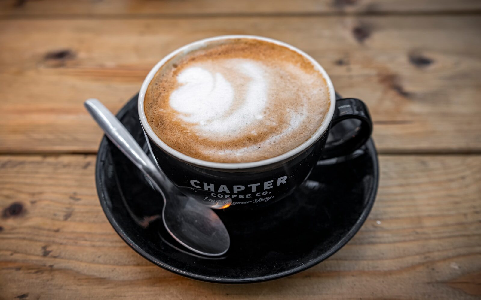 a cup of coffee with a spoon